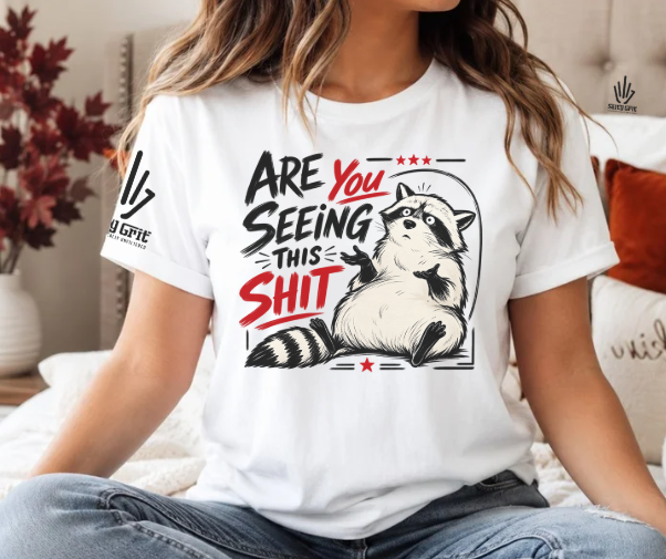 Funny raccoon graphic tee with sarcastic Are You Seeing This Shit design