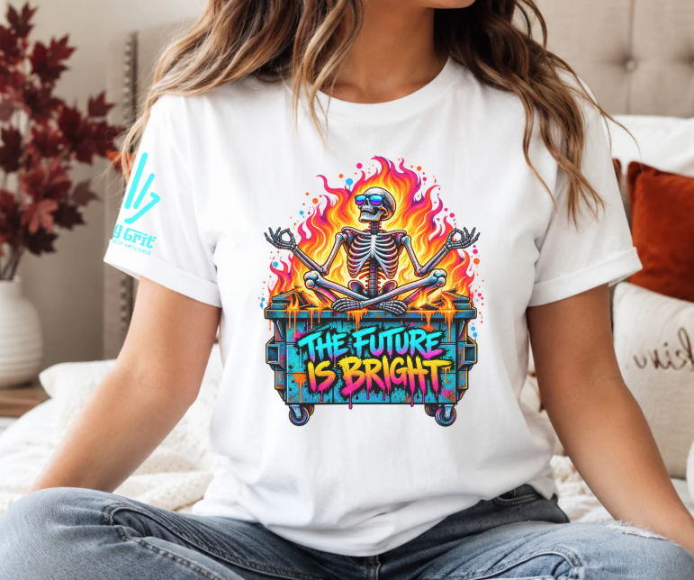 “The Future Is Bright” shirt graphic featuring a skeleton in sunglasses sitting in a flaming dumpster.