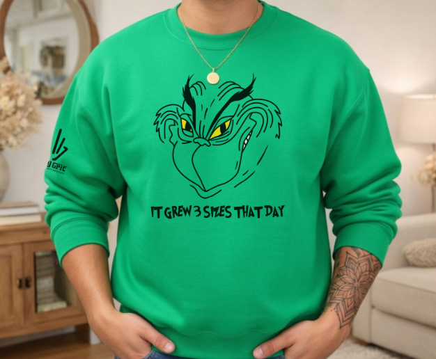 Men's Christmas sweatshirt featuring a mischievous Grinch face grin