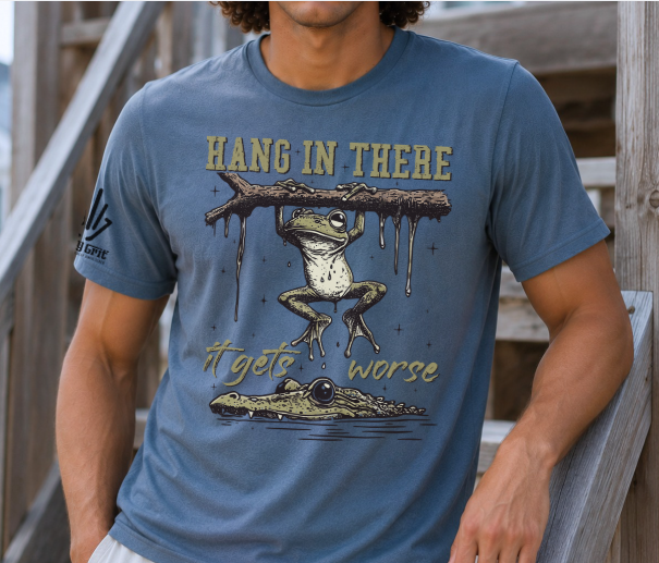 Funny Hang in There It Gets Worse shirt featuring a frog hanging from a branch above an alligator