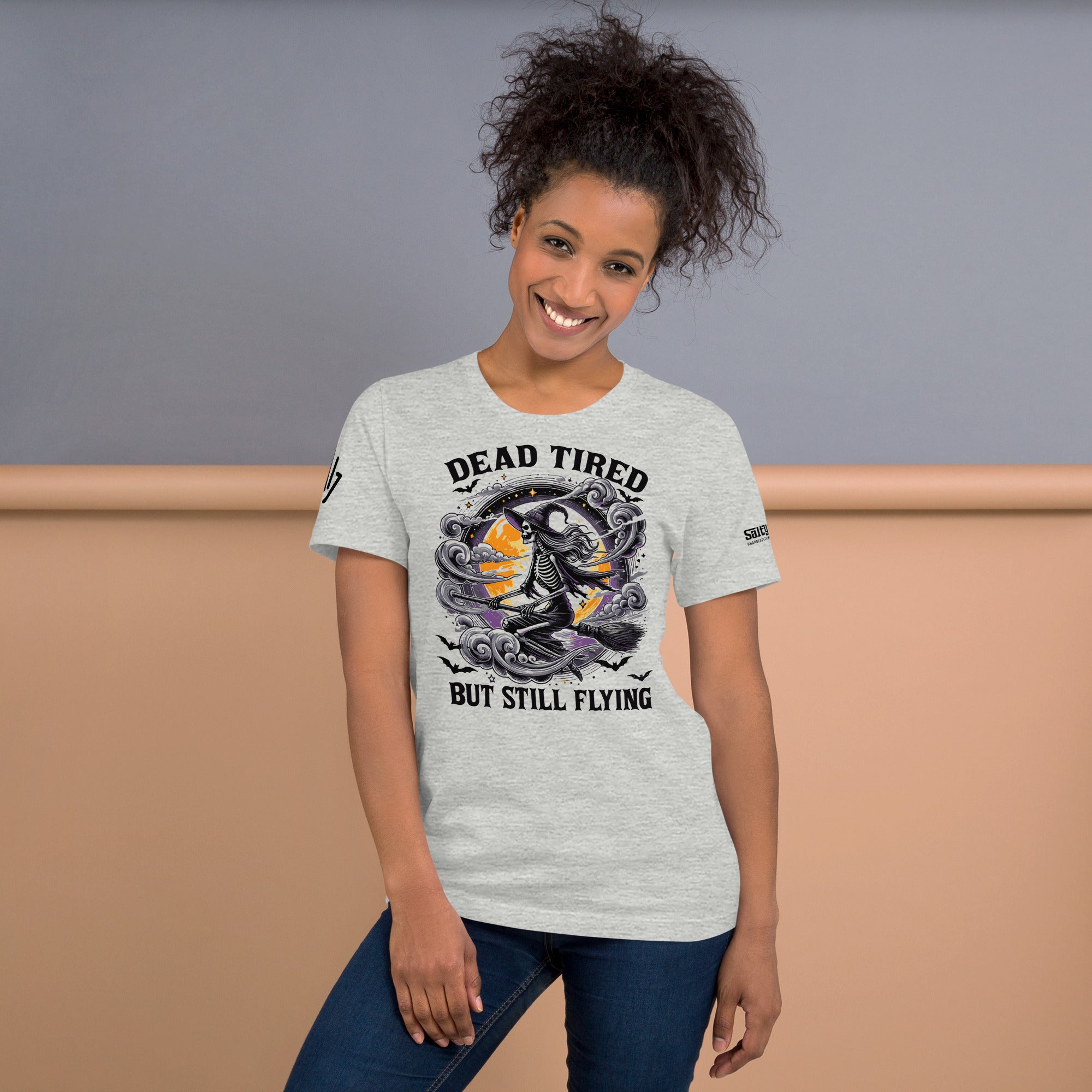Halloween graphic tee with sarcastic Dead Tired But Still Flying slogan