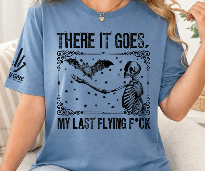 Funny shirt featuring There It Goes My Last Flying Fuck with a skeleton and flying bat