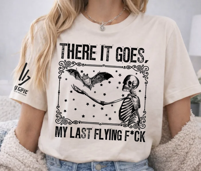Sarcastic skeleton graphic tee featuring a flying bat and funny quote