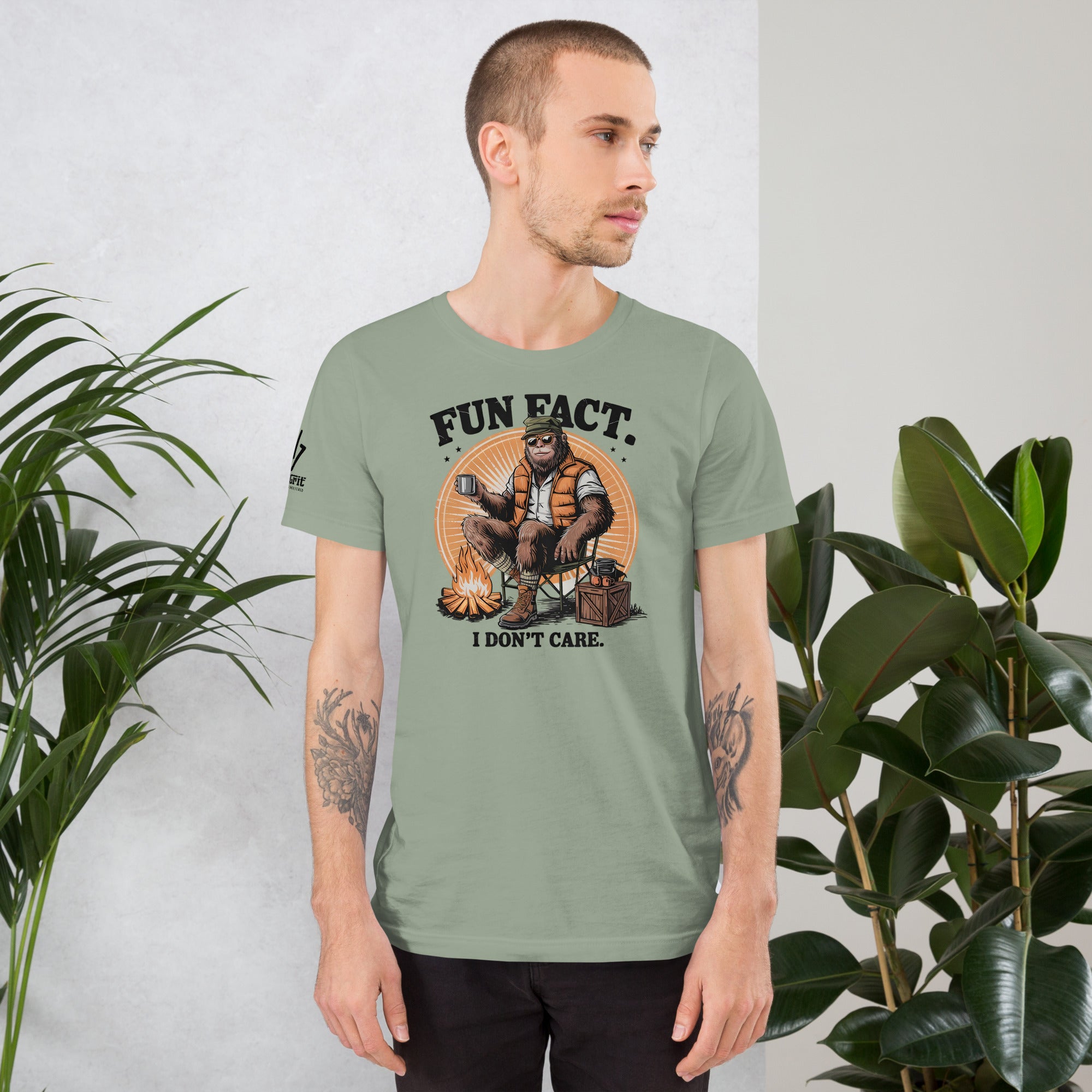 Bigfoot sitting by campfire on sarcastic graphic tee