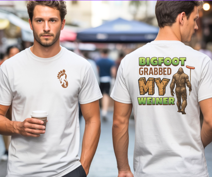 Funny shirt featuring Bigfoot Grabbed My Weiner with Bigfoot holding a hot dog on a stick
