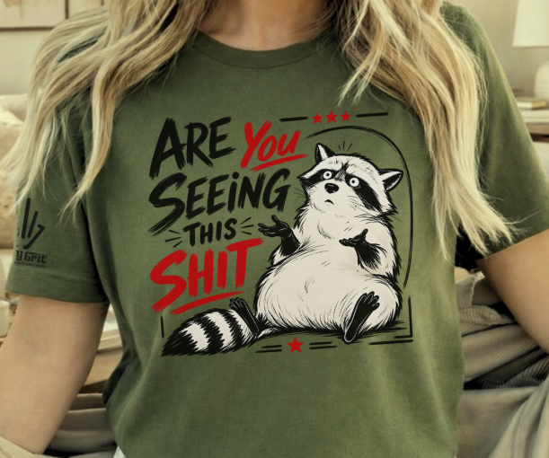 Funny shirt featuring Are You Seeing This Shit with a concerned raccoon