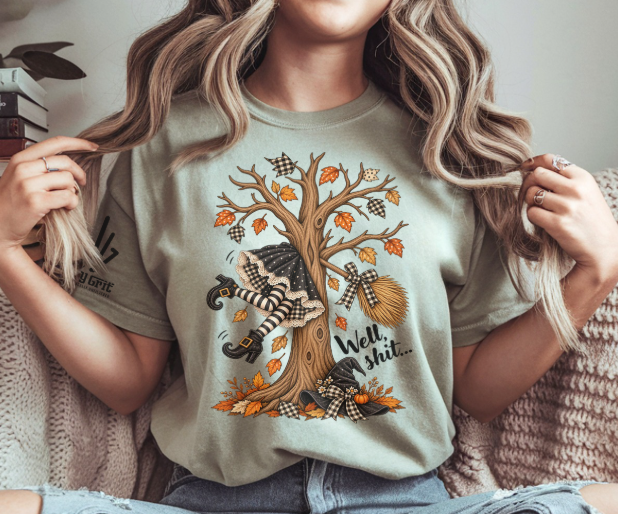 Funny Well Shit Halloween shirt featuring a witch crashed into a tree