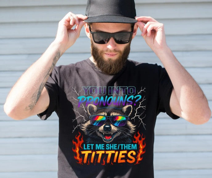 Person wearing a black t-shirt with a graphic design and text, standing against a plain background.