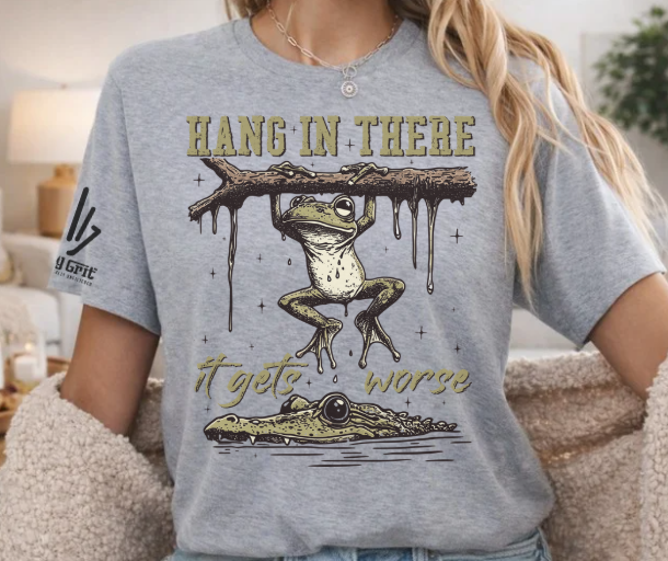 Sarcastic frog graphic tee featuring a frog hanging over an alligator