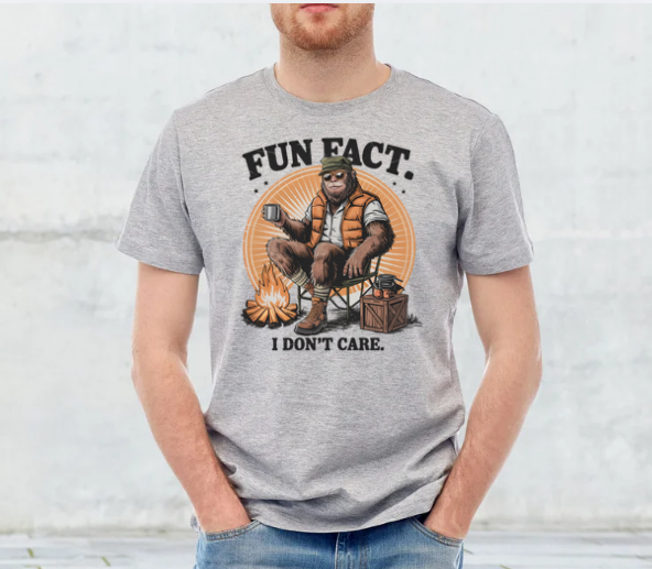 Sarcastic graphic tee with Bigfoot camping in the woods