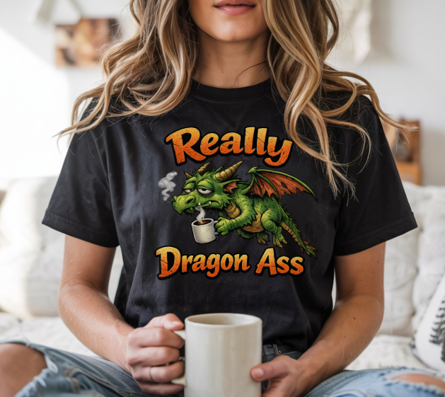 Graphic tee featuring an exhausted dragon drinking coffee