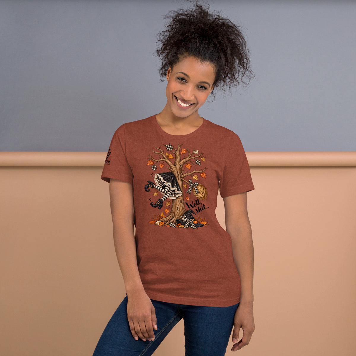 Sarcastic Halloween tee featuring a witch flying into a tree